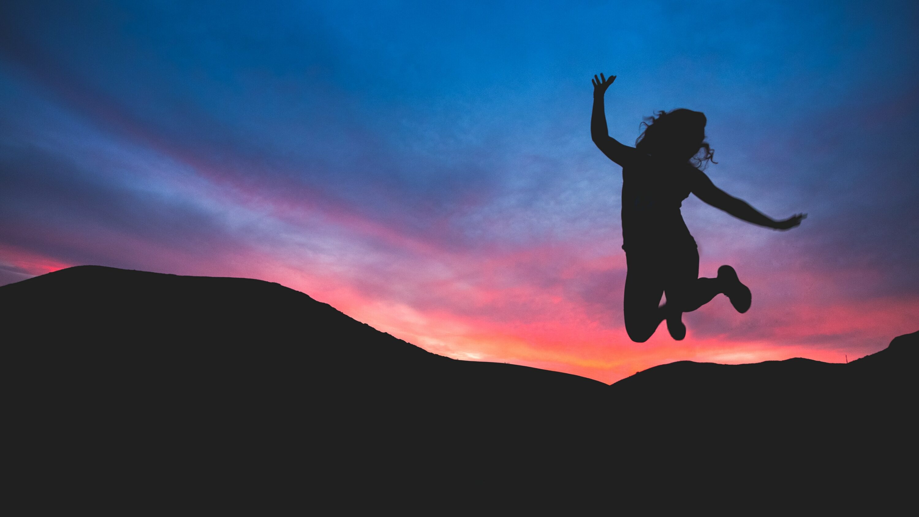A silhouette of someone jumping into the air, demonstrating the power of becoming the voice of motivation