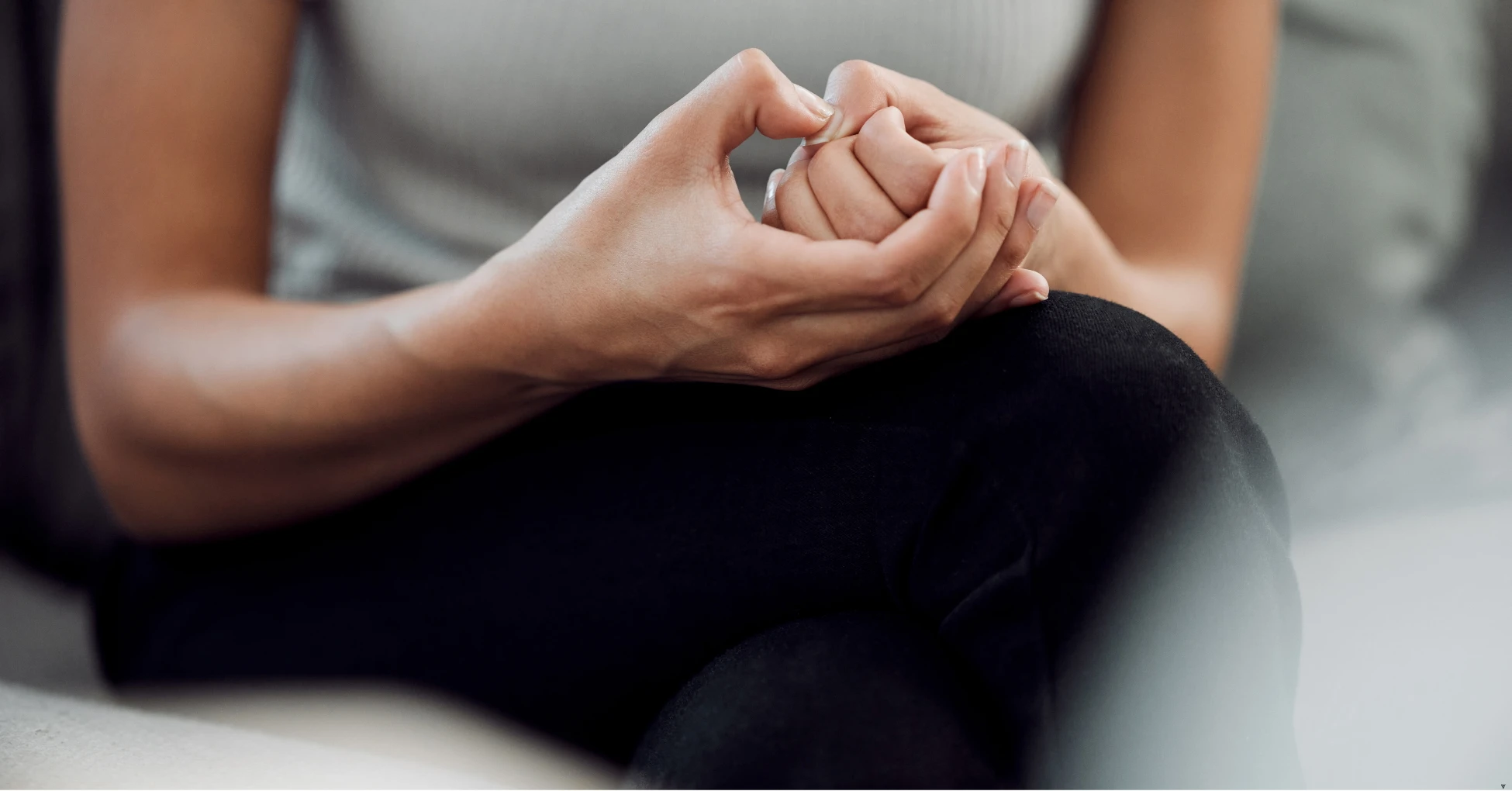 person with anxiety picking their nails